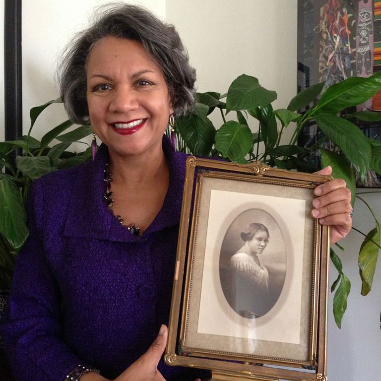 A'Lelia Bundles holds up a picture of her great-great-grandmother, Madam C.J. Walker.