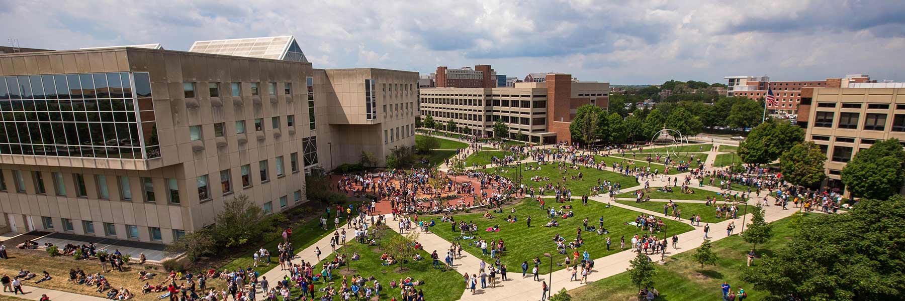Students gather in front of University Library during the solar eclipse in 2017.