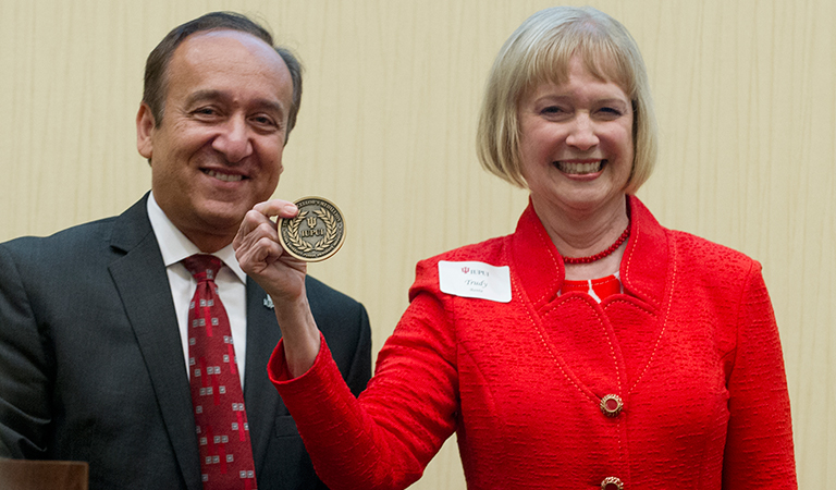 Chancellor Paydar and Trudy Banta with her award