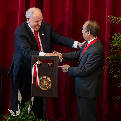 IUPUI Chancellor Paydar receives the IU President's Medal for Excellence from IU President Michael McRobbie