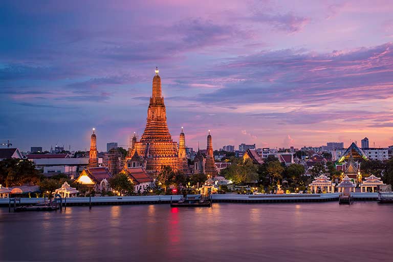 A view of the Wat Arun Buddhist temple in Bangkok from across the Chao Phraya River.